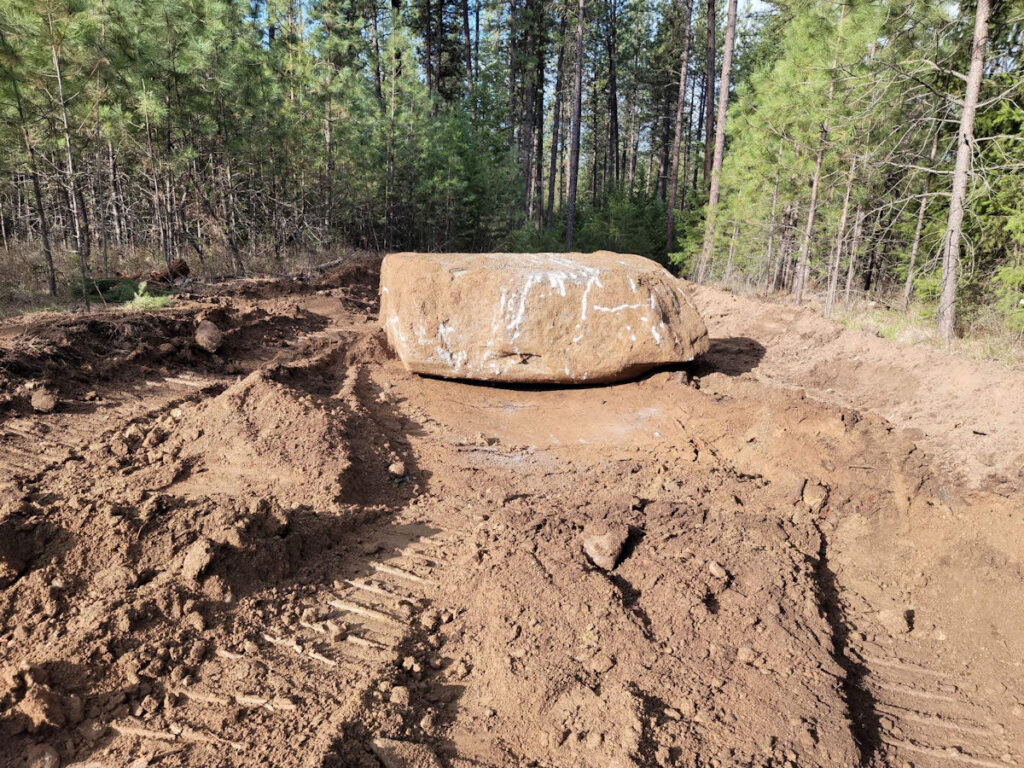 Massive boulder found in the middle of our roadway.