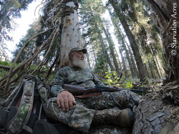 Author sitting during a bear hunt.
