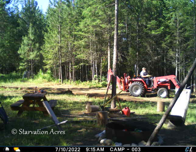 Tractor being used to flatten a pad for coming building.